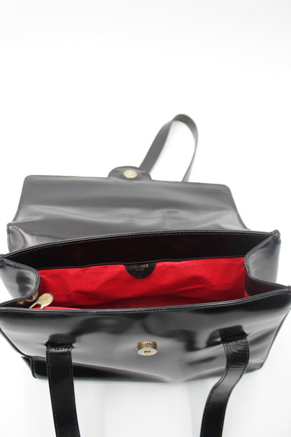 Skuldertaske i lakeret læder